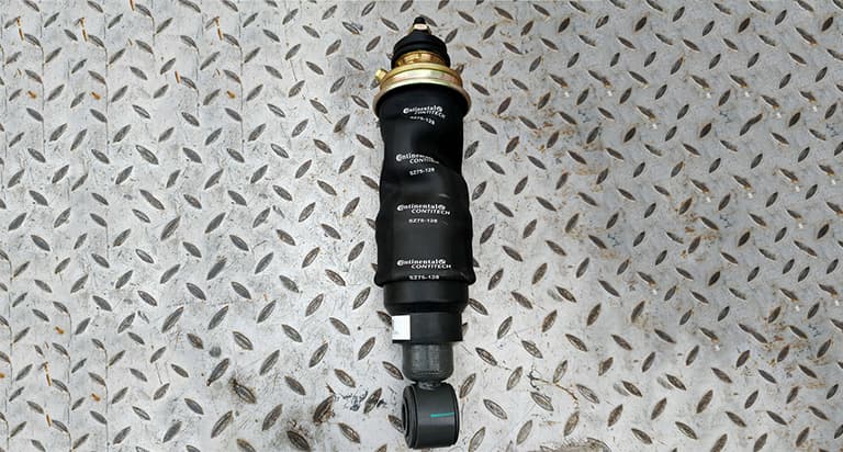 Cab front shock absorber