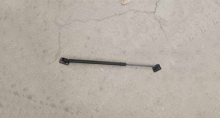 Rear door left gas spring assembly