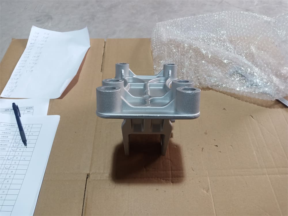 Cab front suspension transition bracket